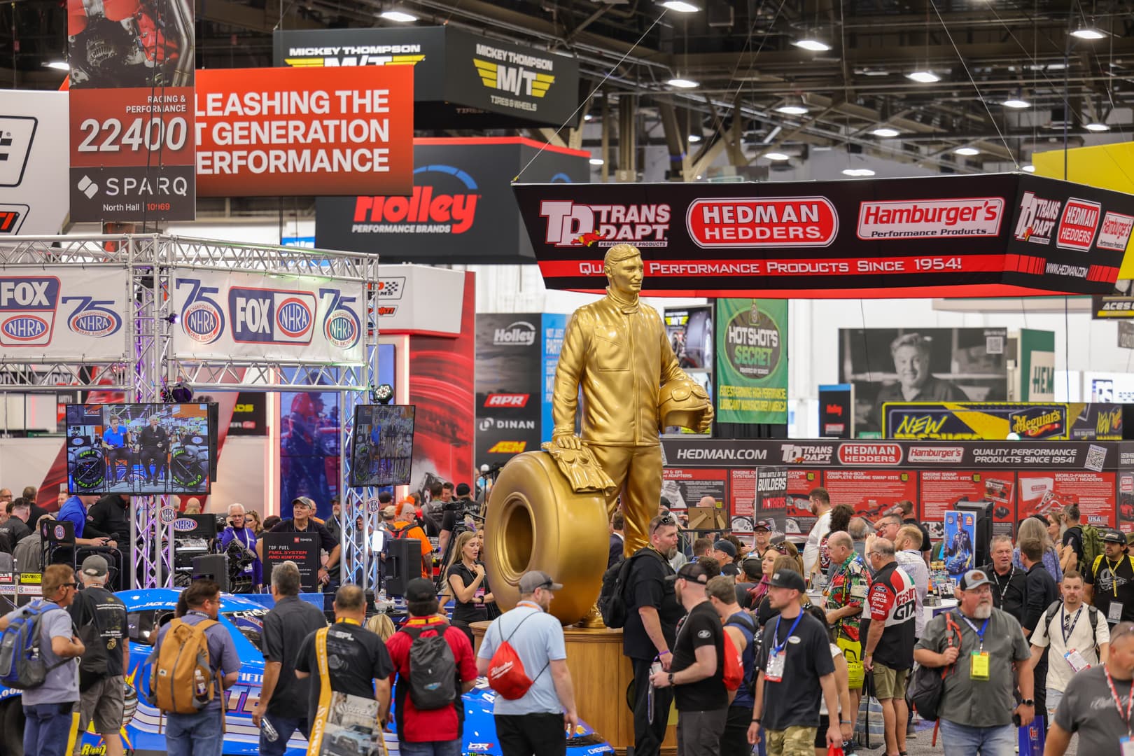 Crowded racing and performance show floor at SEMA