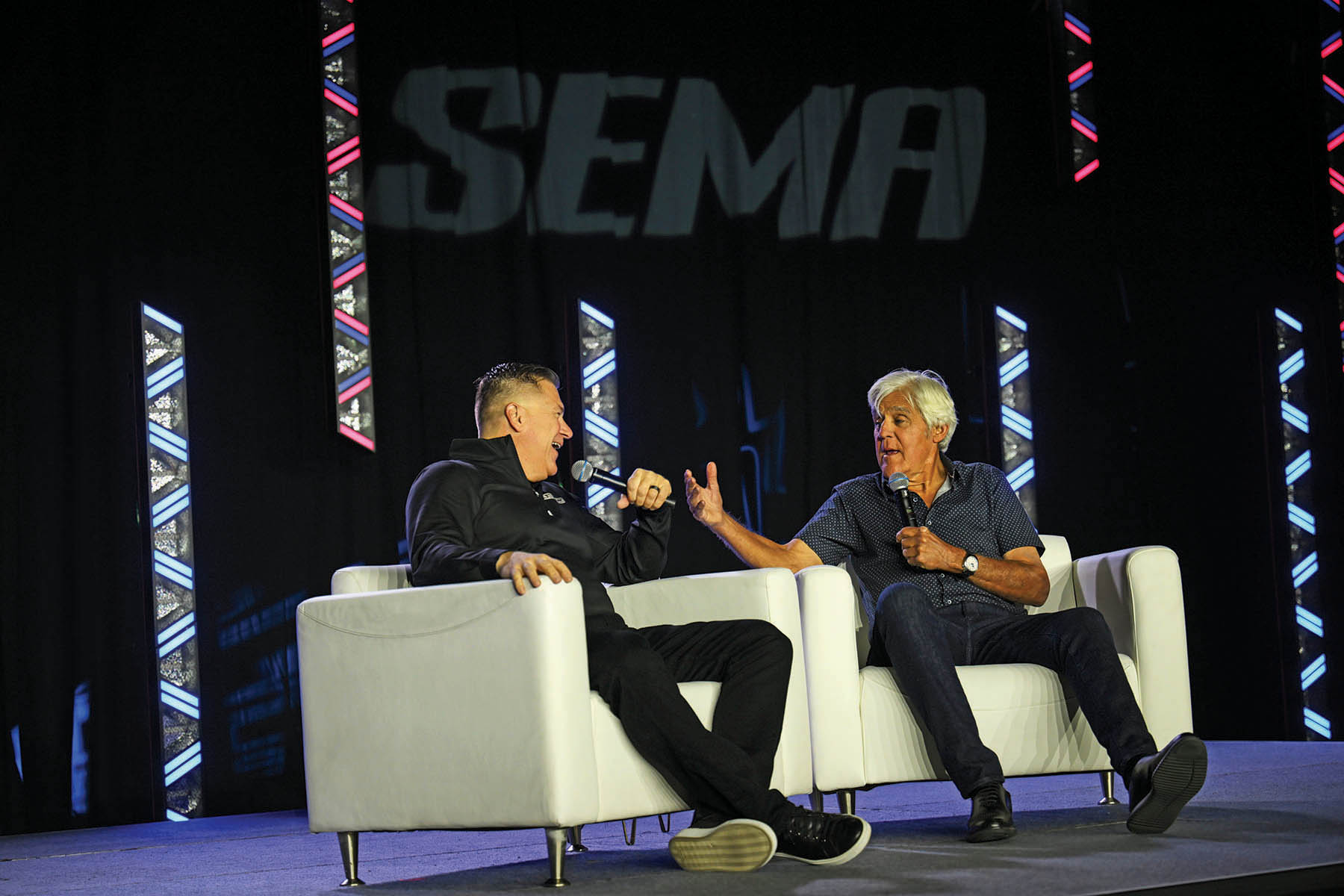 Jay Leno being interviewed on teh SEMA Central stage 