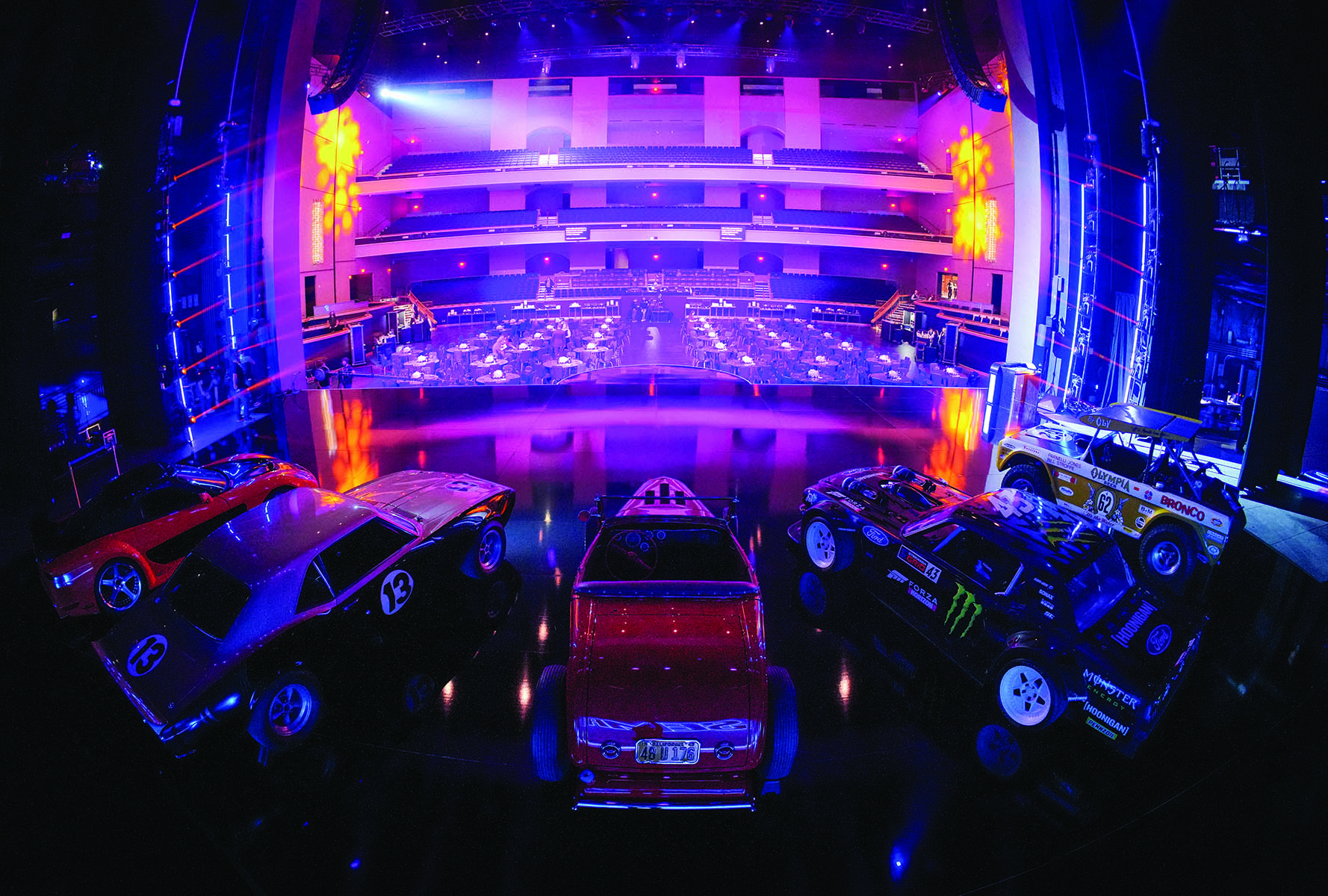 Cool cars on stage facing audience