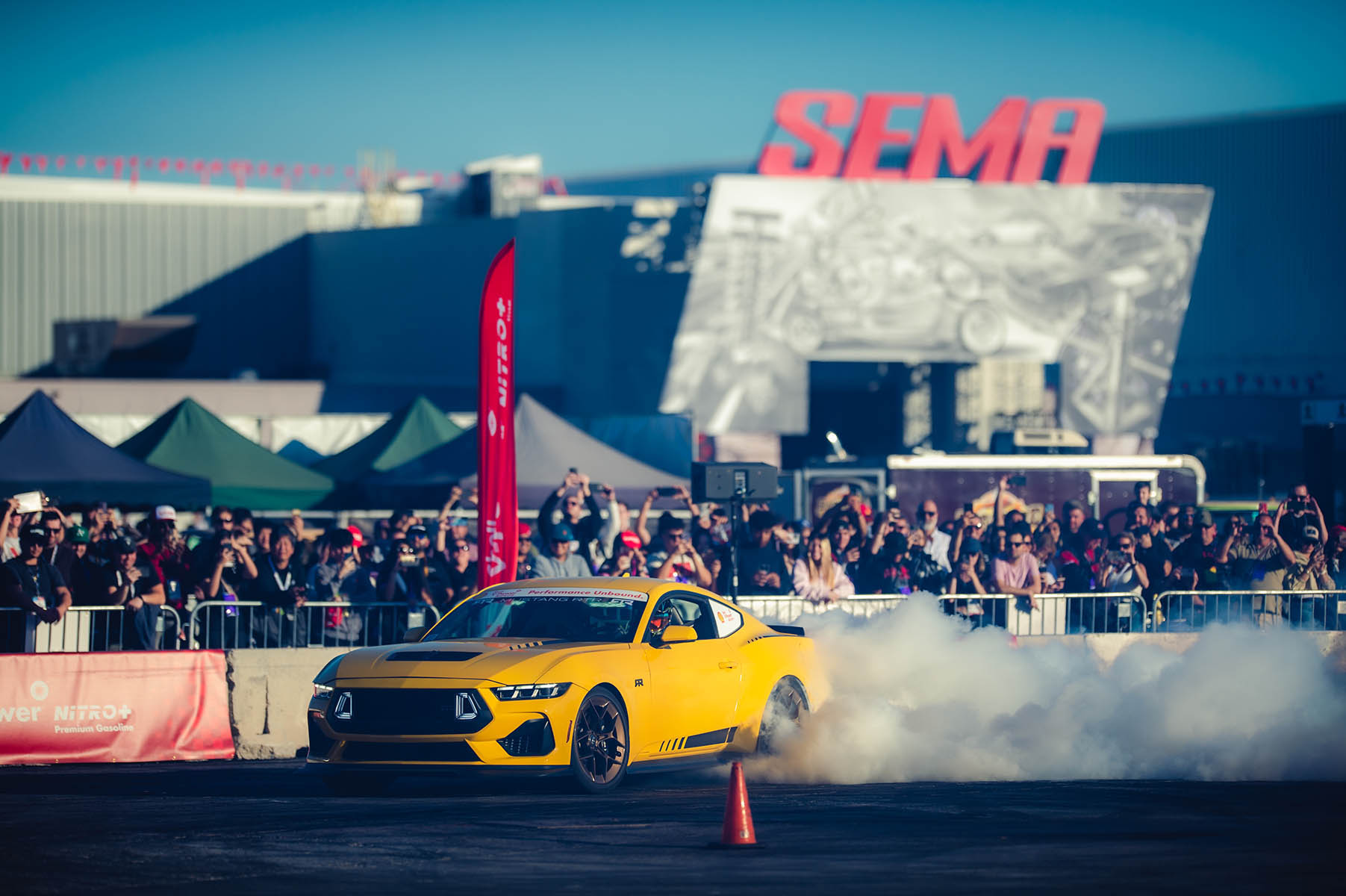 Car making smoke outside the SEMA Show